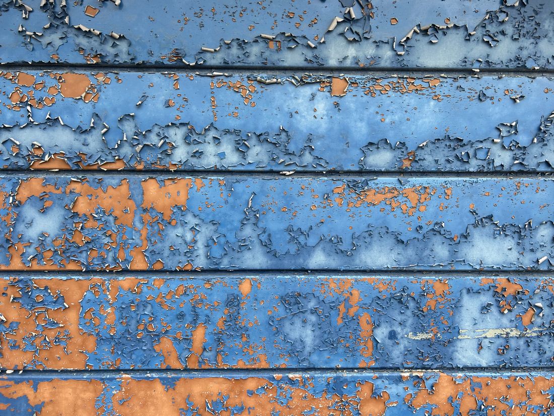 Peeling paint on old boards
